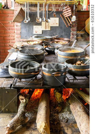 Traditional wood stove preparing typical Brazilian 61610332