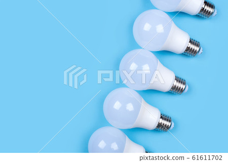Several LED bulb on blue background. Saving energy concept. Several LED bulb on blue background. Saving energy concept. 61611702