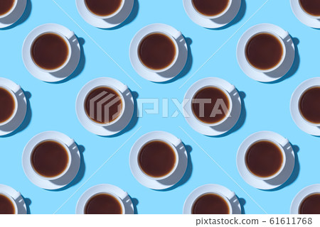 Pattern of cups of black coffee or tea on a blue background. Pattern of cups of black coffee or tea on a blue background. 61611768