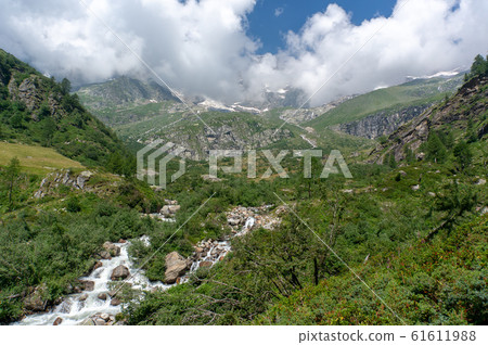 Hiking for health in Italian alps landscape 61611988