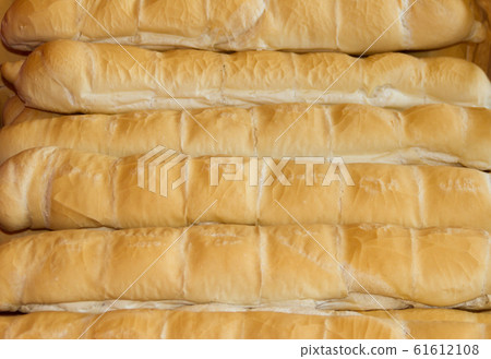 background of baked wheat flour breads in the 61612108