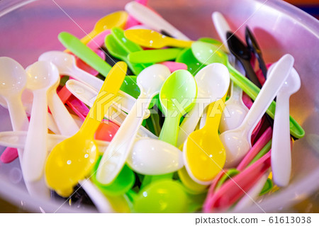 Colourful plastic spoons to recycle and stop 61613038