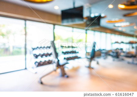Abstract blur gym room interior with fitness equipment 61616047