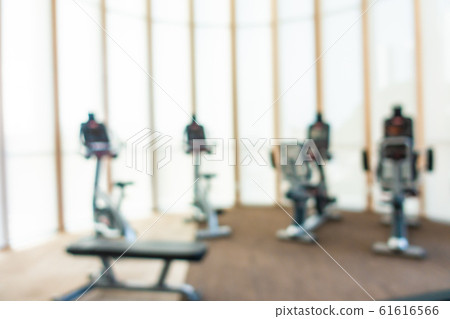 Abstract blur gym room interior with fitness equipment 61616566