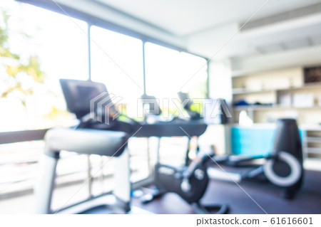 Abstract blur gym room interior with fitness equipment Abstract blur gym room interior with fitness equipment 61616601