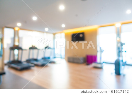 Abstract blur gym room interior with fitness equipment Abstract blur gym room interior with fitness equipment 61617142