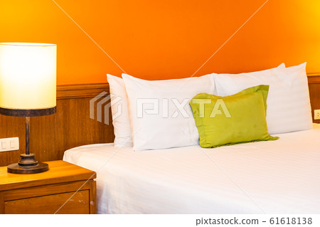 White comfortable pillow on bed decoration interior White comfortable pillow on bed decoration interior 61618138