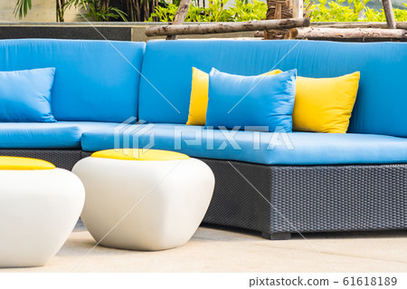 Outdoor patio in the garden with sofa chair and pillow decoration 61618189