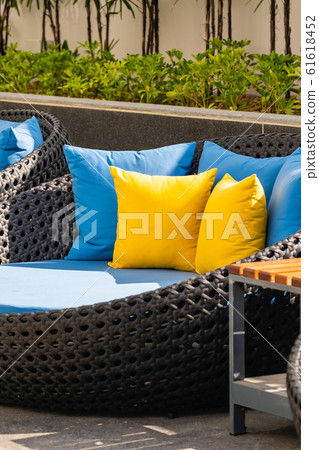 Outdoor patio in the garden with sofa chair and pillow decoration 61618452