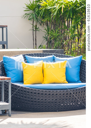Outdoor patio in the garden with sofa chair and pillow decoration 61618610