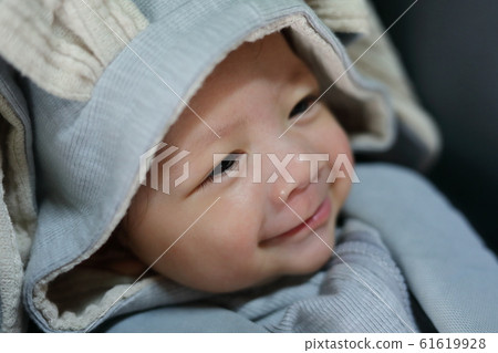 little cute baby happy smile with wearing warm clothing bunny suit little cute baby happy smile with wearing warm clothing bunny suit 61619928