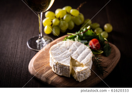 Camembert cheese and white wine 61620333