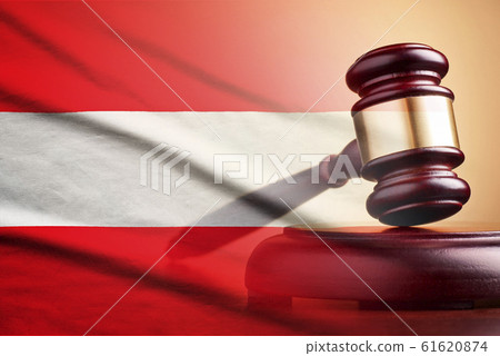 Lawyers wooden gavel over the flag of Austria 61620874