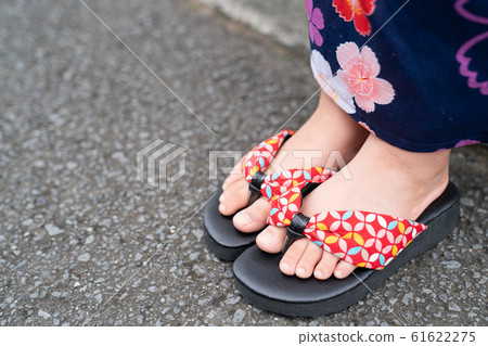The feet of a girl wearing a yukata The feet of a girl wearing a yukata 61622275