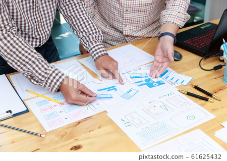 Graphic designers work together with UX UI Graphic designers work together with UX UI 61625432