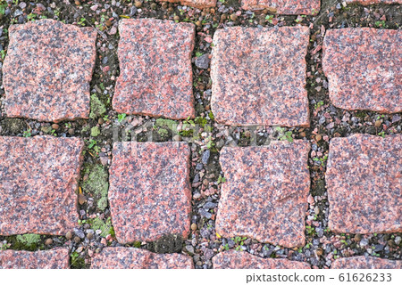 Background of granite squares with green moss 61626233