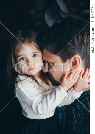 Dad holds the baby in his arms. The concept of educating the father of young children, Happy childhood, a friendly family. 61627772