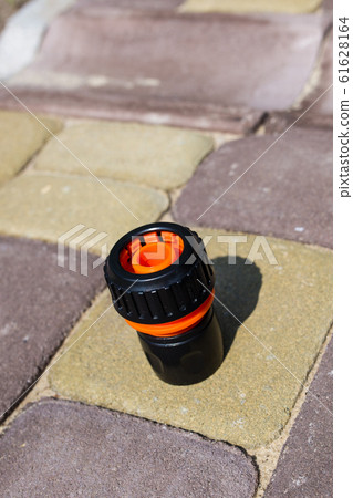 Connector for watering hose at the dacha. Close-up. Connector for watering hose at the dacha. Close-up. 61628164