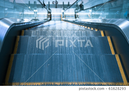 Escalator stairs in station. 61628293