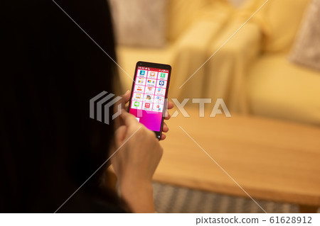 Lifestyle home smartphone operation 61628912