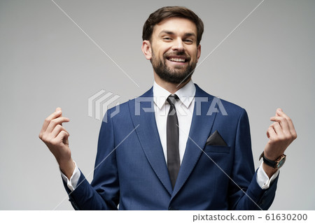 Studuo shot of thinking businessman wearing suit Studuo shot of thinking businessman wearing suit 61630200