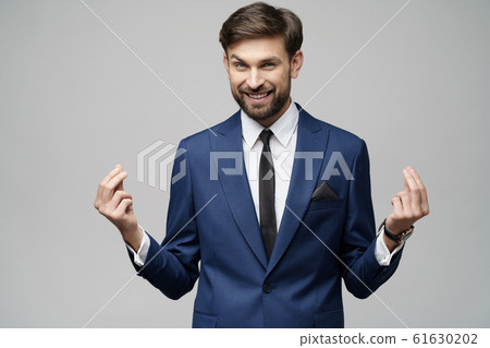 Studuo shot of thinking businessman wearing suit 61630202
