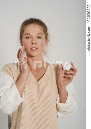 Minimalistic portrait of a young beautiful joyful attractive woman. Minimalistic portrait of a young beautiful joyful attractive woman. 61630901