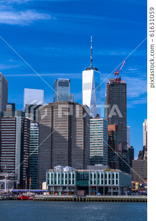 "New York" View of Brooklyn Bridge Park, a skyscraper in Manhattan 61631059