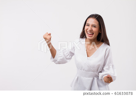 excited asian woman looking up 61633078