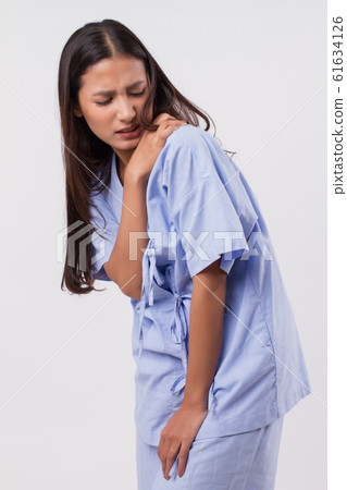 woman with shoulder or neck pain, stiffness, 61634126