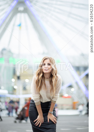 Gorgeus blonde woman in leather skirt posing on Gorgeus blonde woman in leather skirt posing on 61634220