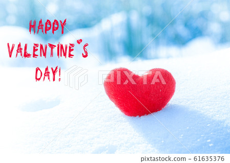 Red heart on snowy background. symbol of love, 61635376