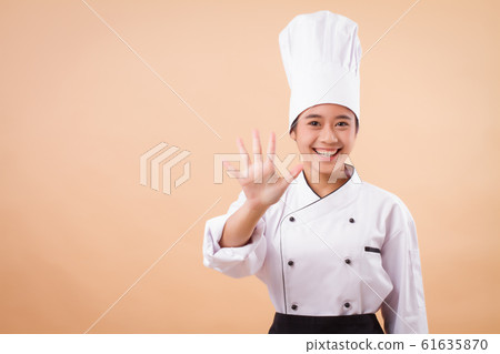 female asian chef pointing up five fingers gesture 61635870