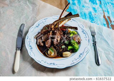 Rack of lamb with vegetables. The cuisine of Tel Rack of lamb with vegetables. The cuisine of Tel 61637522