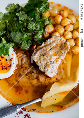 Turkey steak with chickpeas and egg. The cuisine Turkey steak with chickpeas and egg. The cuisine 61637523