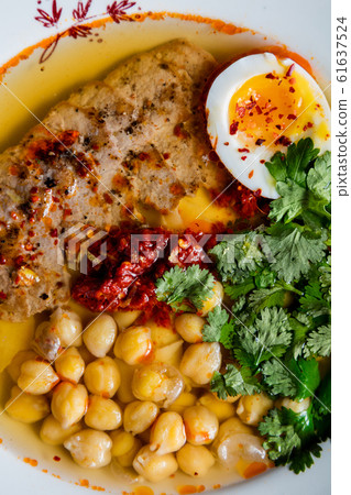 Turkey steak with chickpeas and egg. The cuisine Turkey steak with chickpeas and egg. The cuisine 61637524
