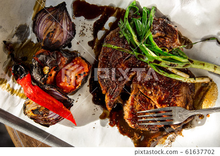 Beef steak with vegetables. The cuisine of Tel Beef steak with vegetables. The cuisine of Tel 61637702