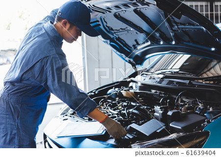 Car mechanic checking to maintenance vehicle by 61639404