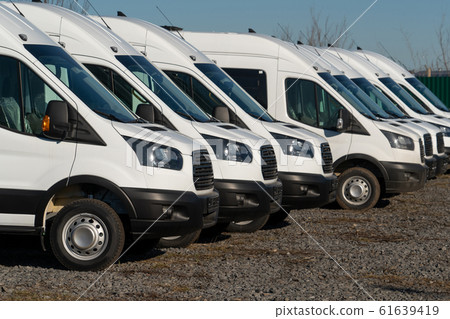 A lot of delivery vans in a row A lot of delivery vans in a row 61639419