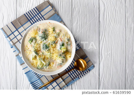 close-up of broccoli and cheddar cheese soup 61639590
