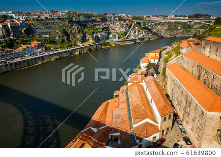 View of Villa Nova de Gaia, Porto city and Douro River in a beautiful early spring day View of Villa Nova de Gaia, Porto city and Douro River in a beautiful early spring day 61639800