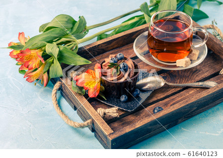Photo of morning cake, blueberries, black tea 61640123