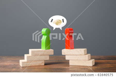 Red and green men meet for a treaty. Truce and agreement. Candidates Political Debate. civilized resolution of conflicts disputes, search for compromise. Networking in business. Negotiation platform. Red and green men meet for a treaty. Truce and agreement. Candidates Political Debate. civilized resolution of conflicts disputes, search for compromise. Networking in business. Negotiation platform. 61640575