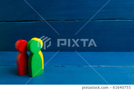Multicolored people stand on a blue background. The concept of community and unity. Team, cooperation and teamwork. Sociological survey. A group of people stands together. Multicolored people stand on a blue background. The concept of community and unity. Team, cooperation and teamwork. Sociological survey. A group of people stands together. 61640755