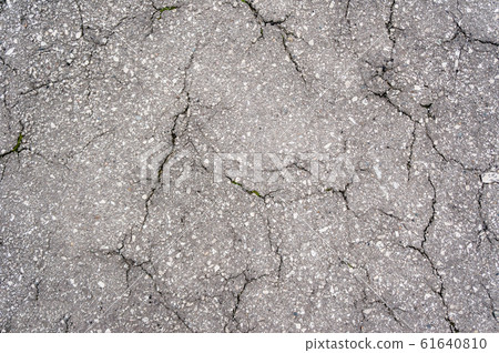 Gray asphalt in cracks. Gray asphalt in cracks. 61640810