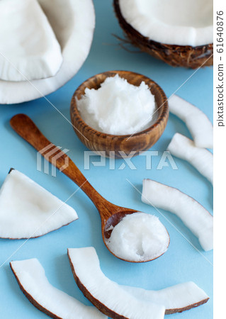 Coconut oil in a bowl with a spoon Coconut oil in a bowl with a spoon 61640876