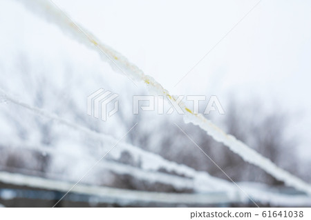 An iced rope for drying clothes. Drying clothes in 61641038