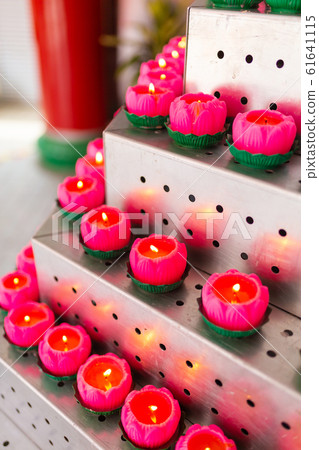 Icon lamps in a Chinese temple left by visitors 61641115