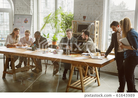 Group of young business professionals having a meeting, creative office 61643989