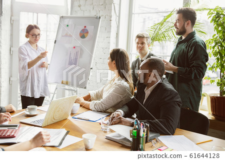 Group of young business professionals having a meeting, creative office 61644128